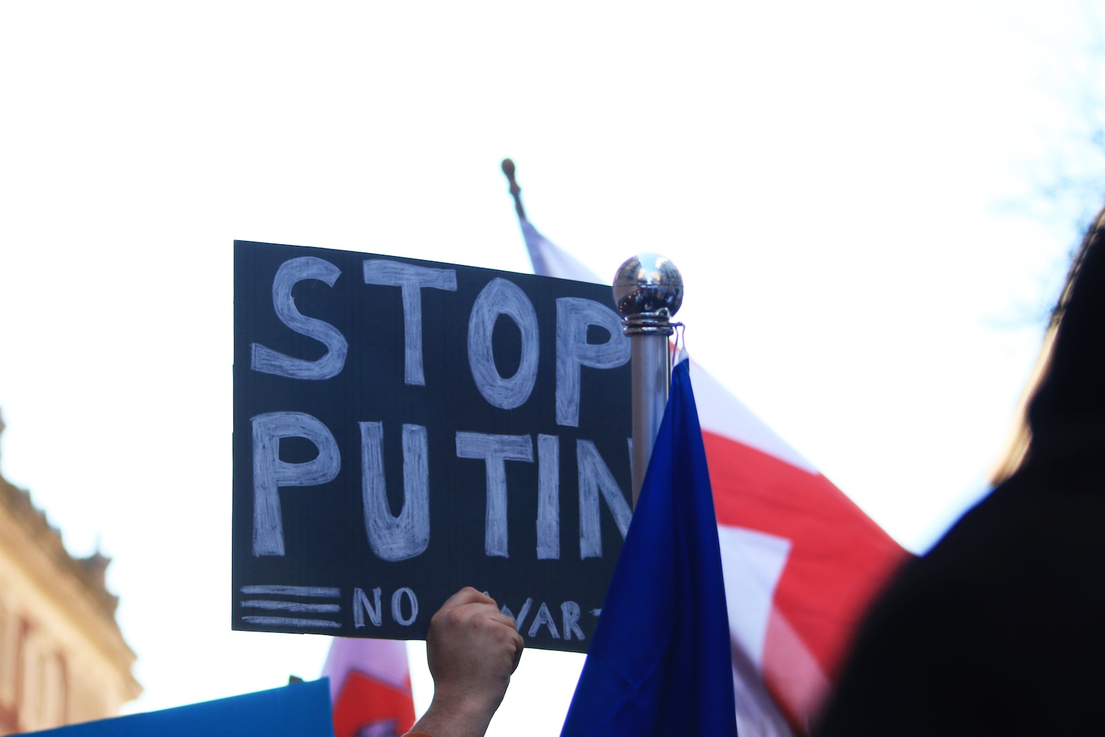 closeup shot of a board saying stop Putin